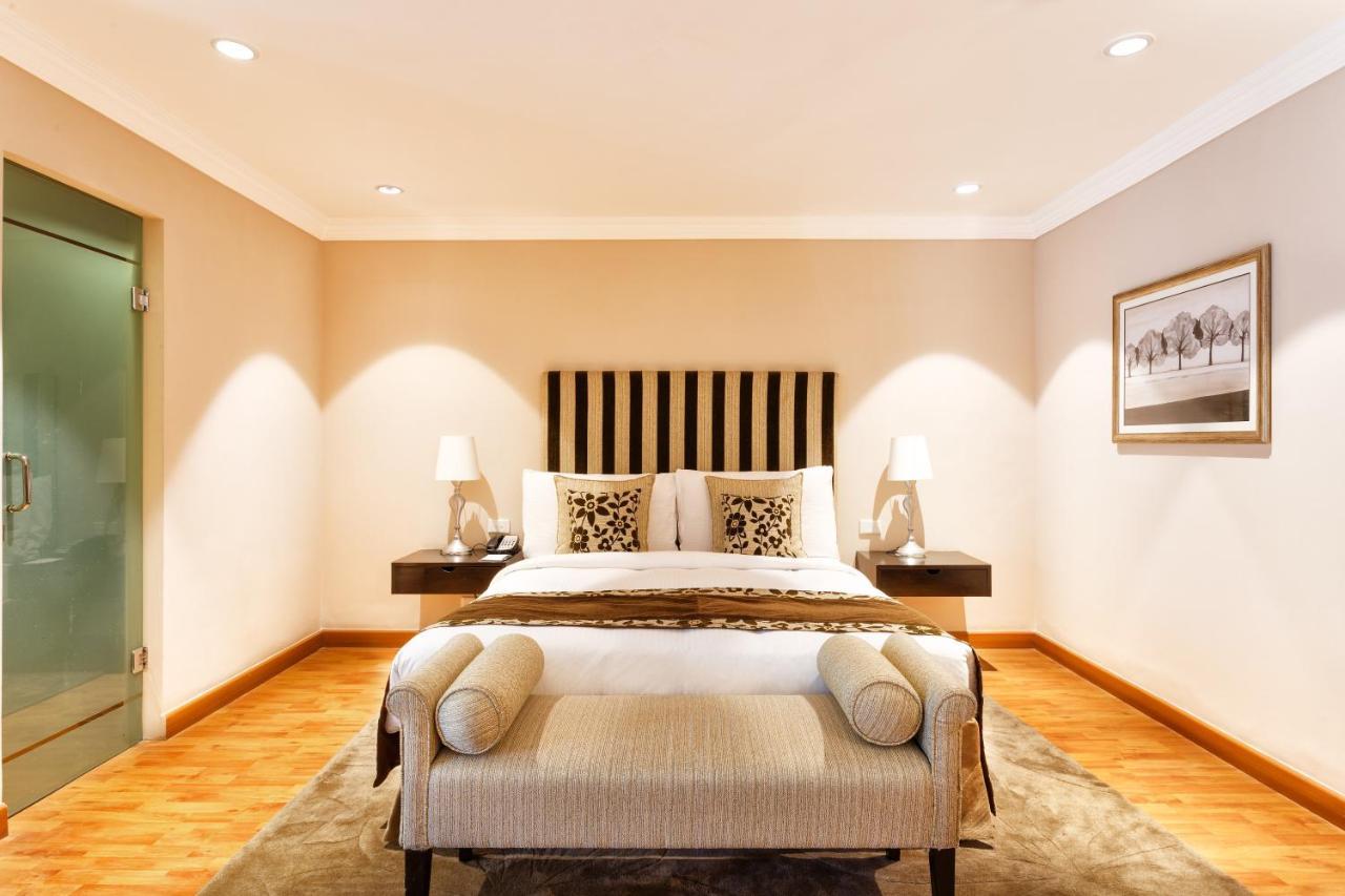 Hotel The Claridges Neu-Delhi Exterior foto A bedroom at the Taj Mahal Palace